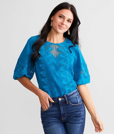 A. Peach Crochet Overlay Top front view