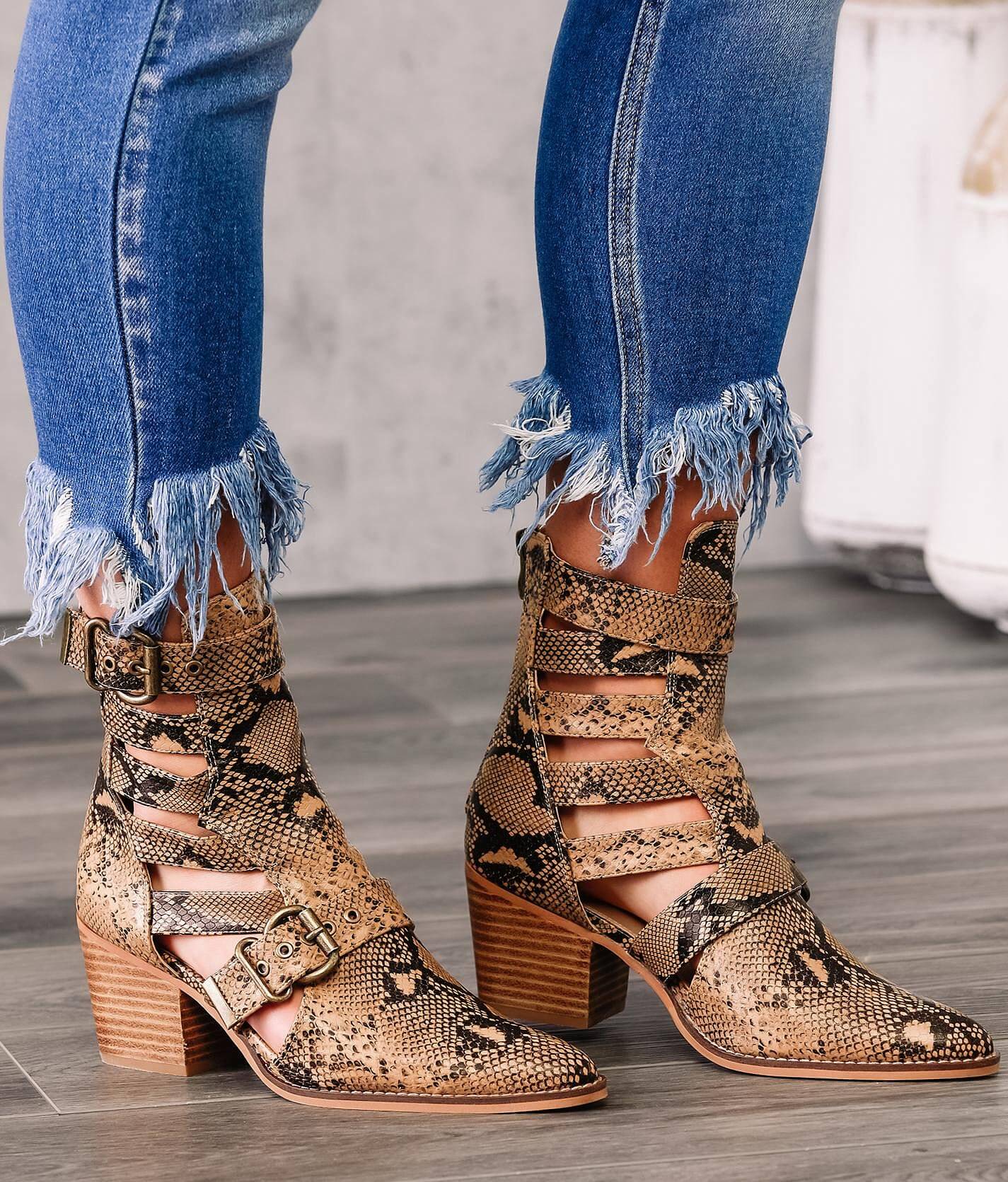 Cut out ankle store boots with buckles