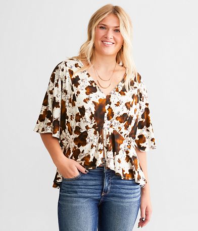 Daytrip Cow Print Split Peplum Top front view