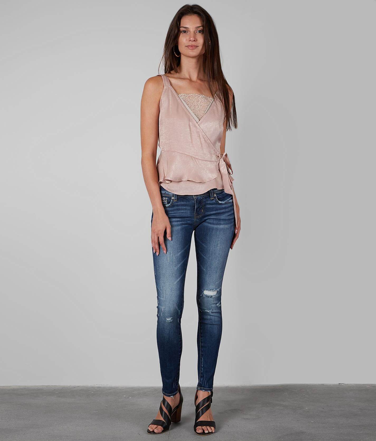 buckle black skinny jeans