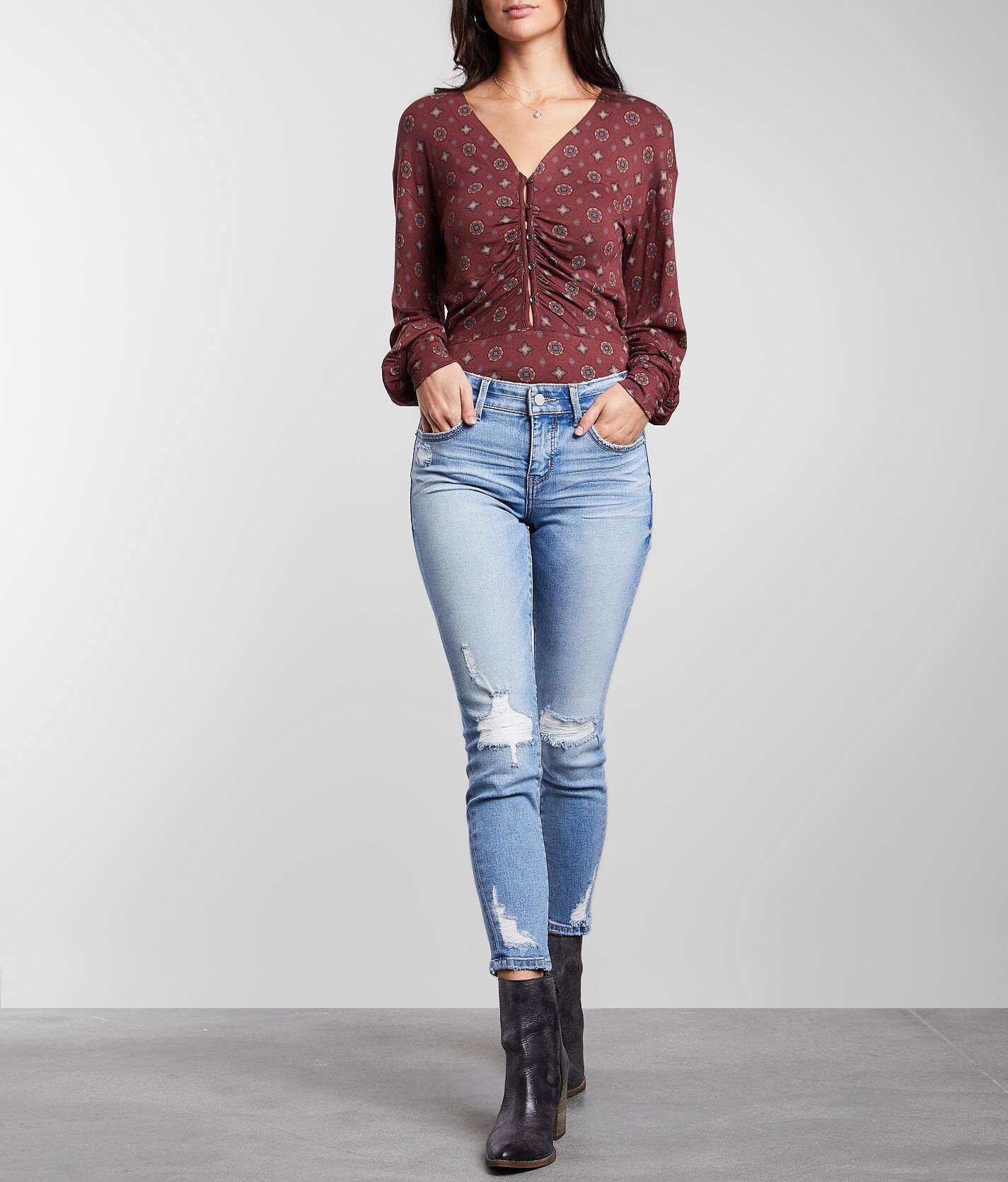 buckle black skinny jeans