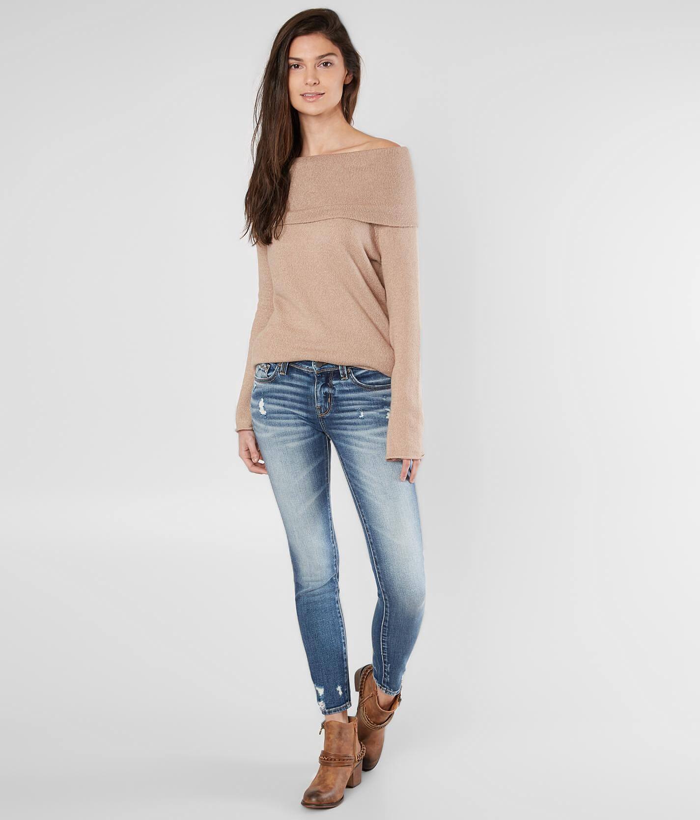 buckle black skinny jeans