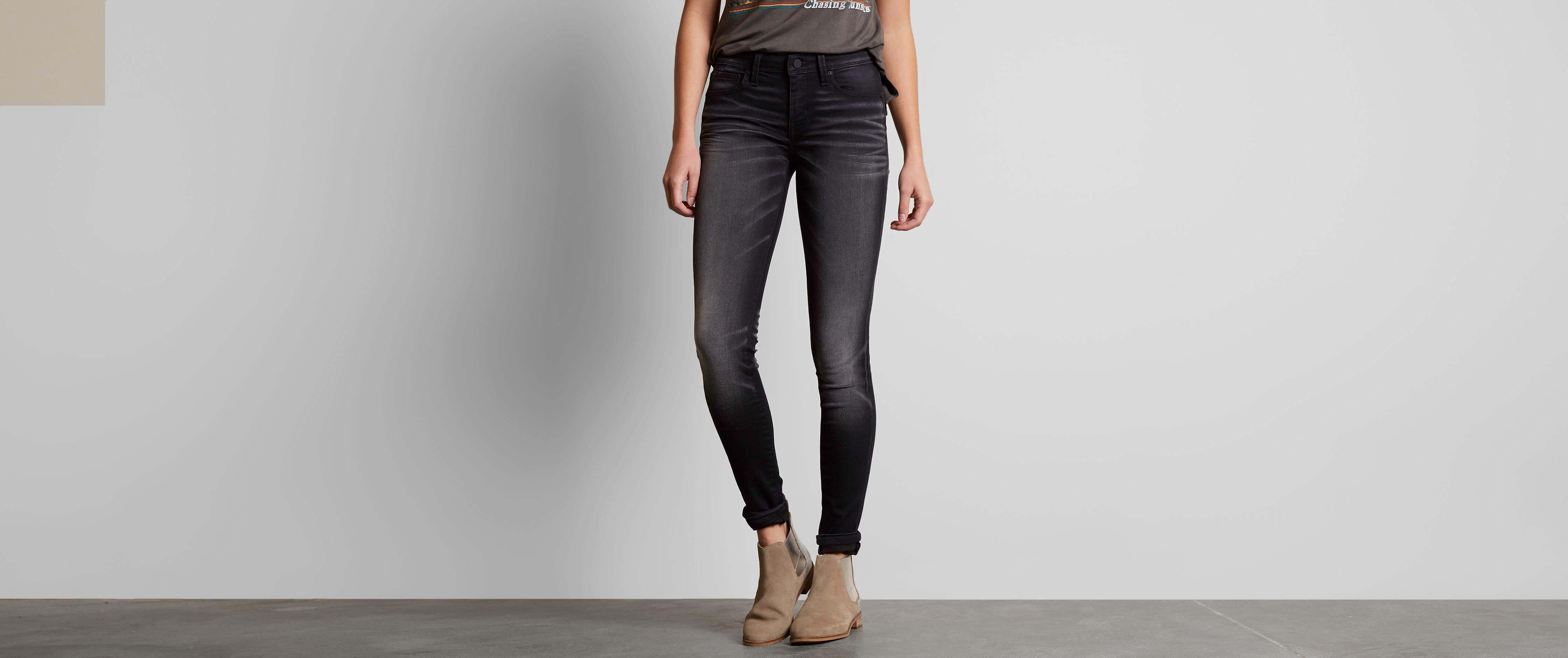 buckle black skinny jeans