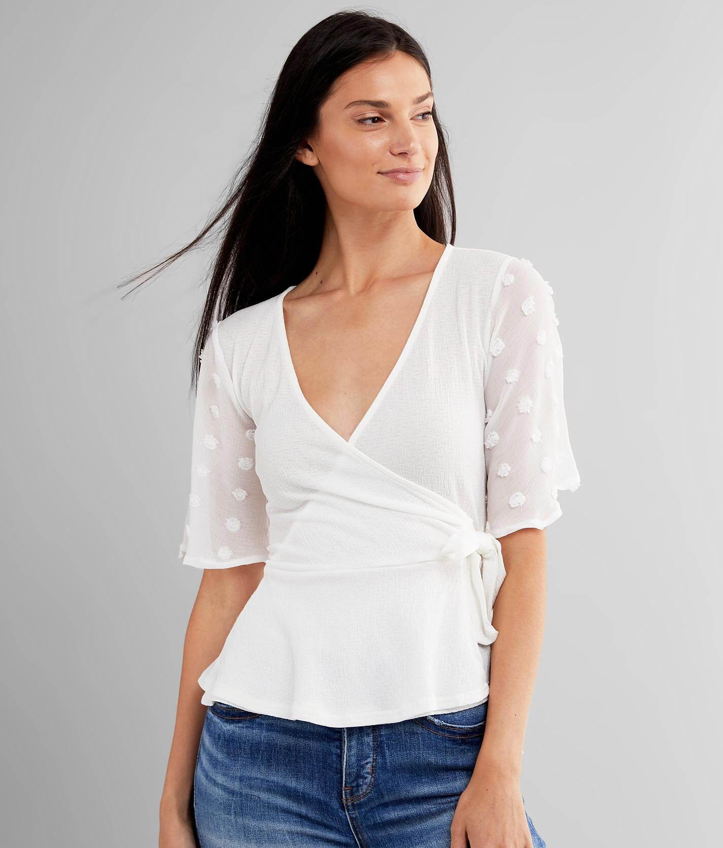 surplice peplum top