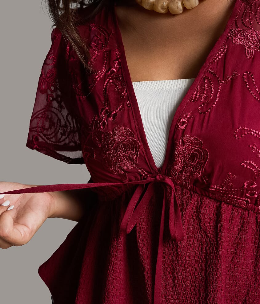 Embroidered Peplum Top