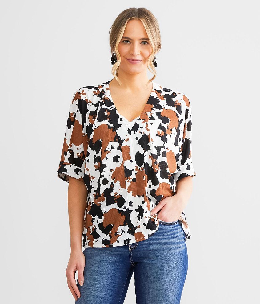 Daytrip Cow Print Dolman Top front view