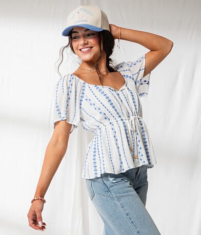 33 Coastal Floral Embroidered Peplum Top front view