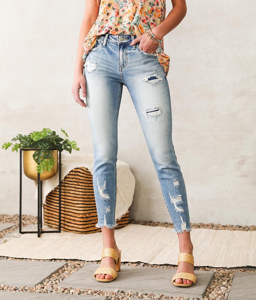 skinny ankle jeans with frayed bottom hem and destruction