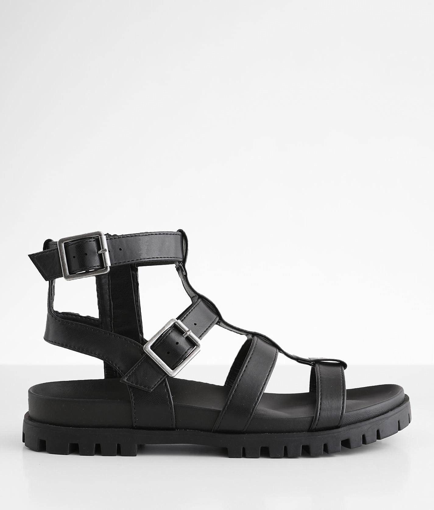 black buckle flatforms