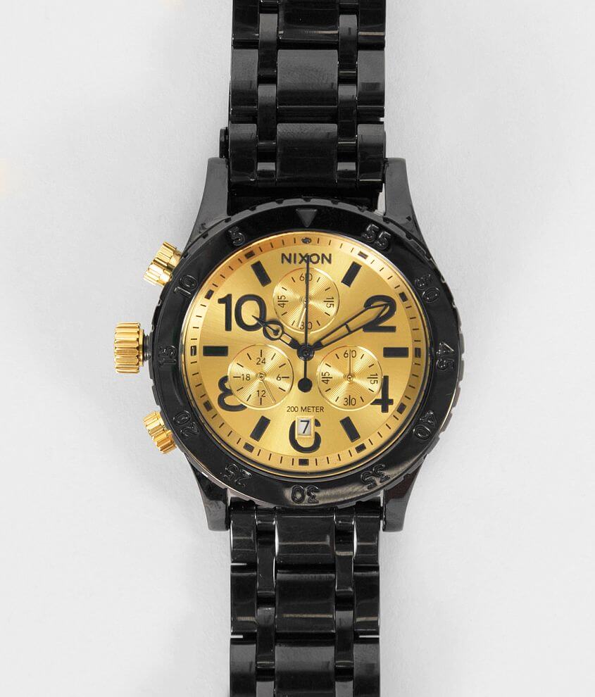 Nixon watch black on sale gold