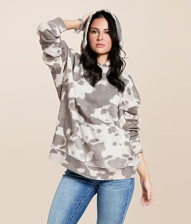 Gilded Intent Cow Print Hooded Sweatshirt front view