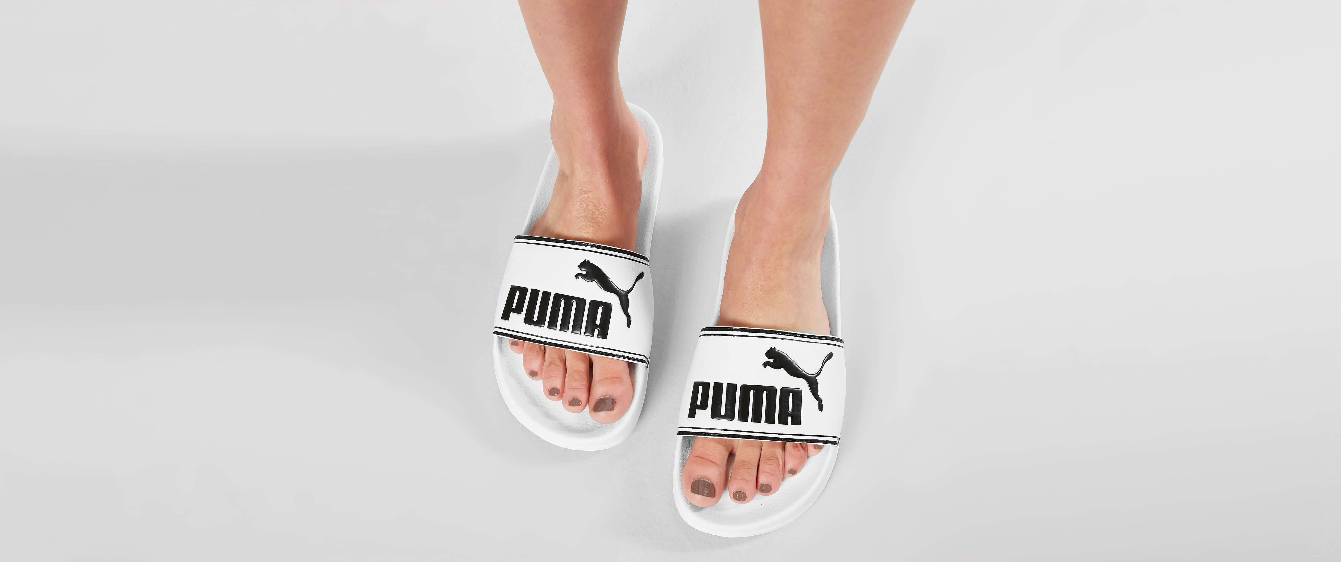 black and white puma slides