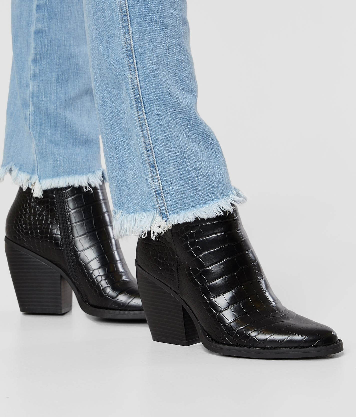 black snakeskin ankle boots