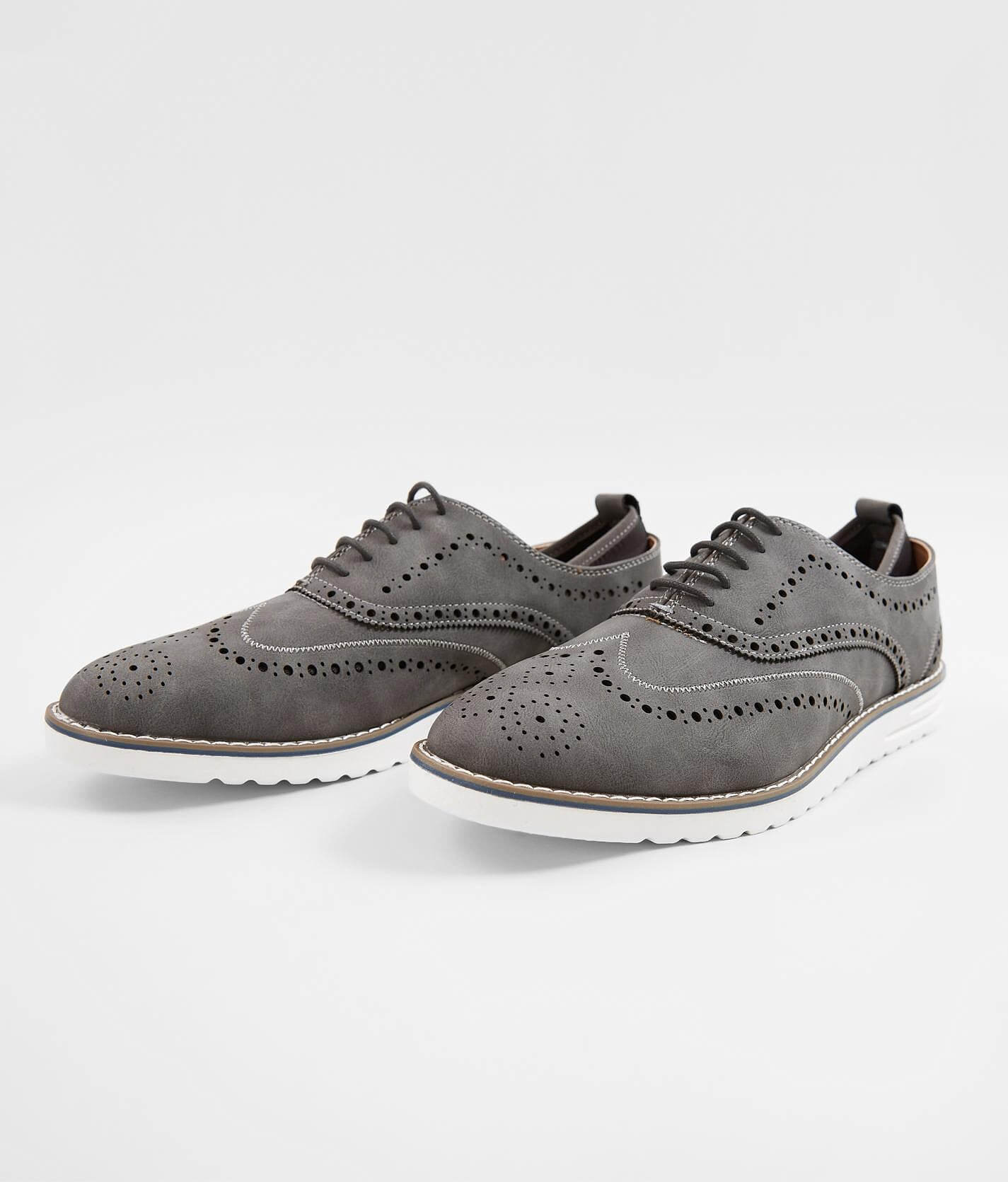 black and grey wingtip shoes