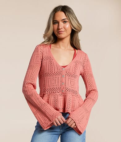 Lumiere Pointelle Peplum Cardigan Sweater front view