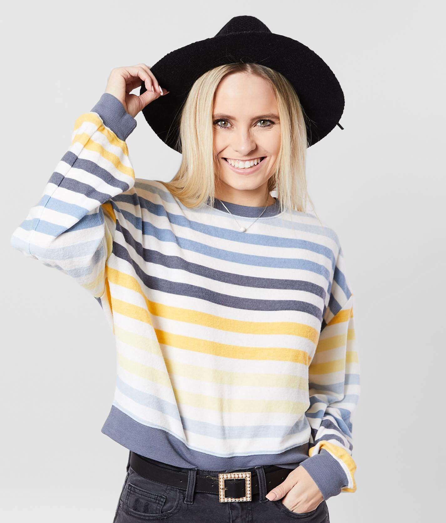 white sweatshirt with rainbow stripe